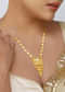 Antique Gold Pendant Necklace With Tusk Motif