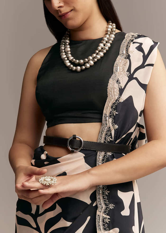 Beige Crepe Saree With Black Floral Print And Embellished Border
