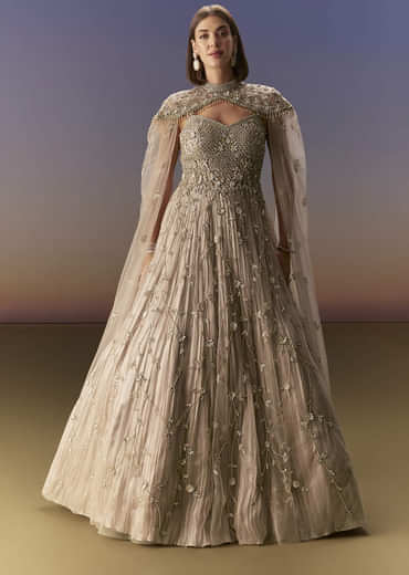 Beige Gown With Shoulder Cape And Rich Vertical Embroidery