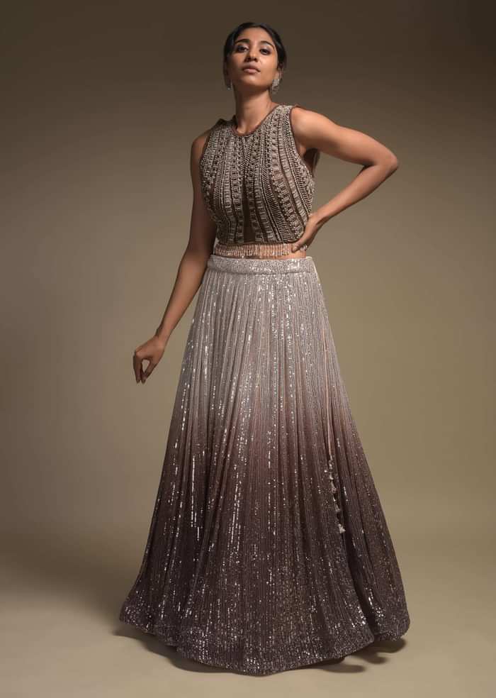 Beige And Taupe Shaded Skirt In Net With Sequins Work And Embellished Sleeveless Crop Top