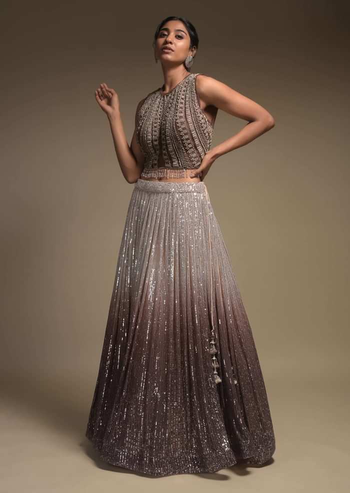 Beige And Taupe Shaded Skirt In Net With Sequins Work And Embellished Sleeveless Crop Top