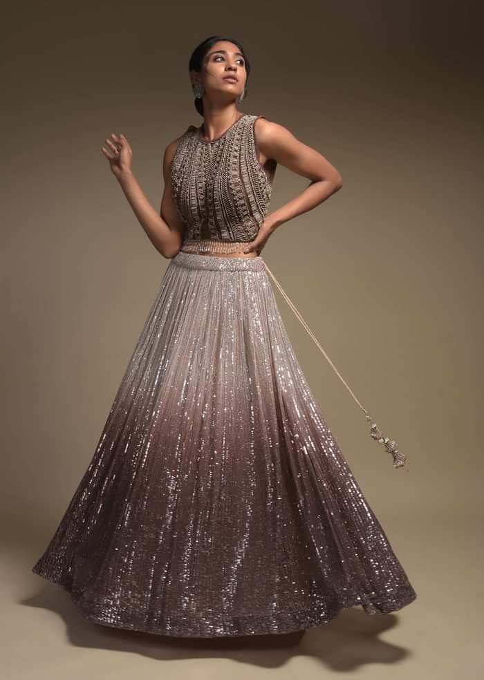 Beige And Taupe Shaded Skirt In Net With Sequins Work And Embellished Sleeveless Crop Top