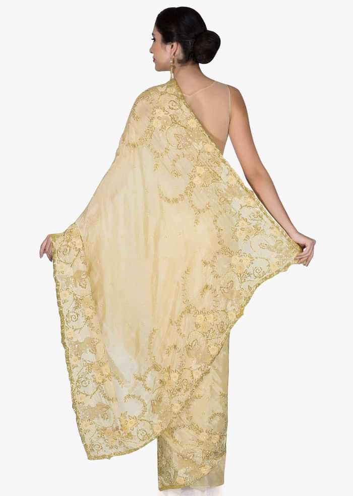 Beige Chiffon Saree and Blouse Crafted with Zari, Cut Dana and Moti only on Kalki
