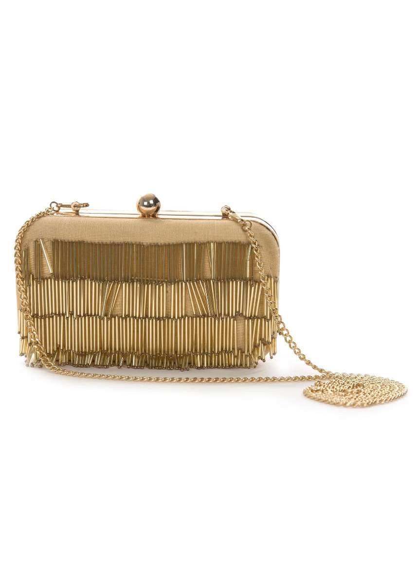 Biege clutch enhanced in tasseled embroidery work only on Kalki