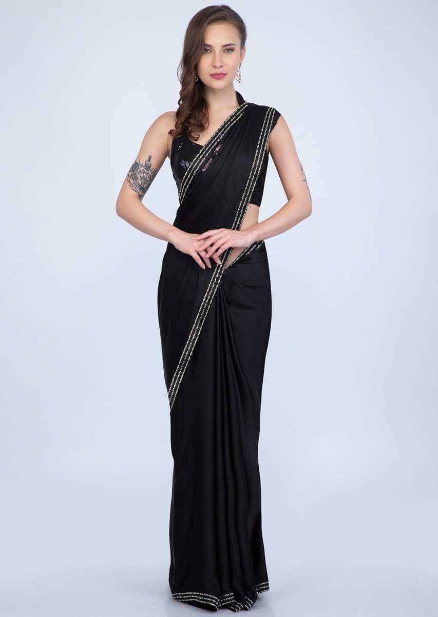 Black satin saree with multi color floral kundan work only on Kalki