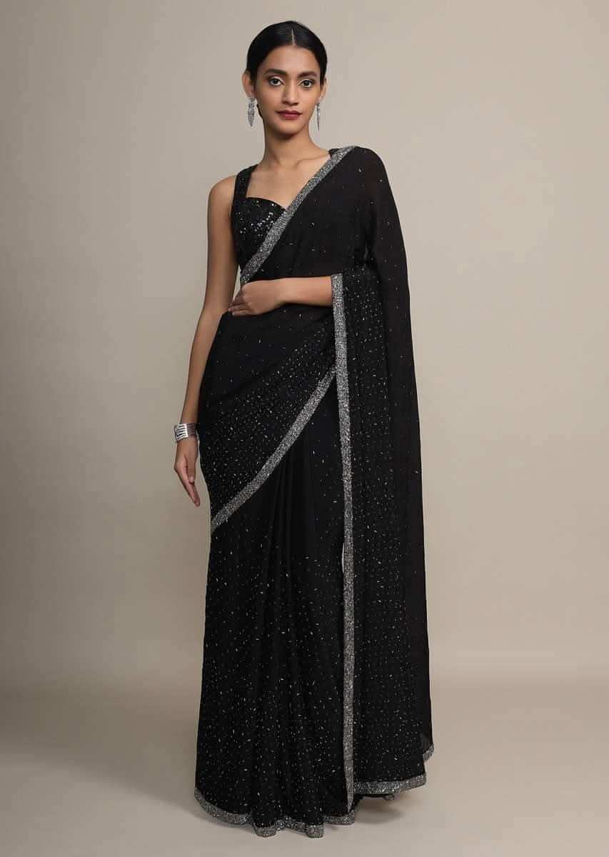 Black chiffon saree with heavy cut dana and pot embroidered border only on Kalki