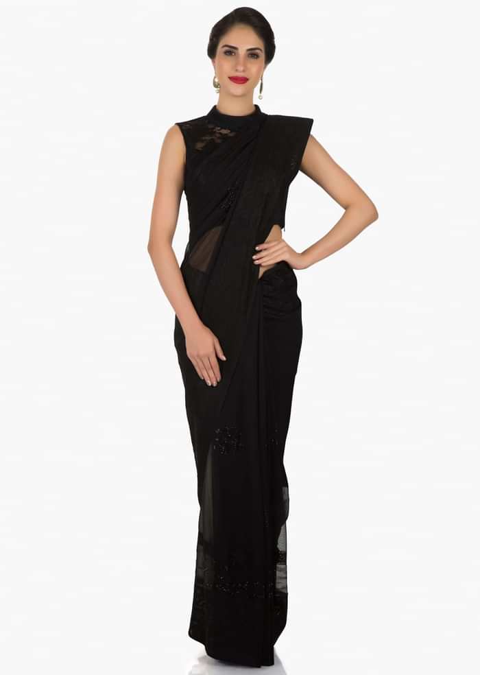 Black georgette saree adorn in thread and kundan work only on Kalki