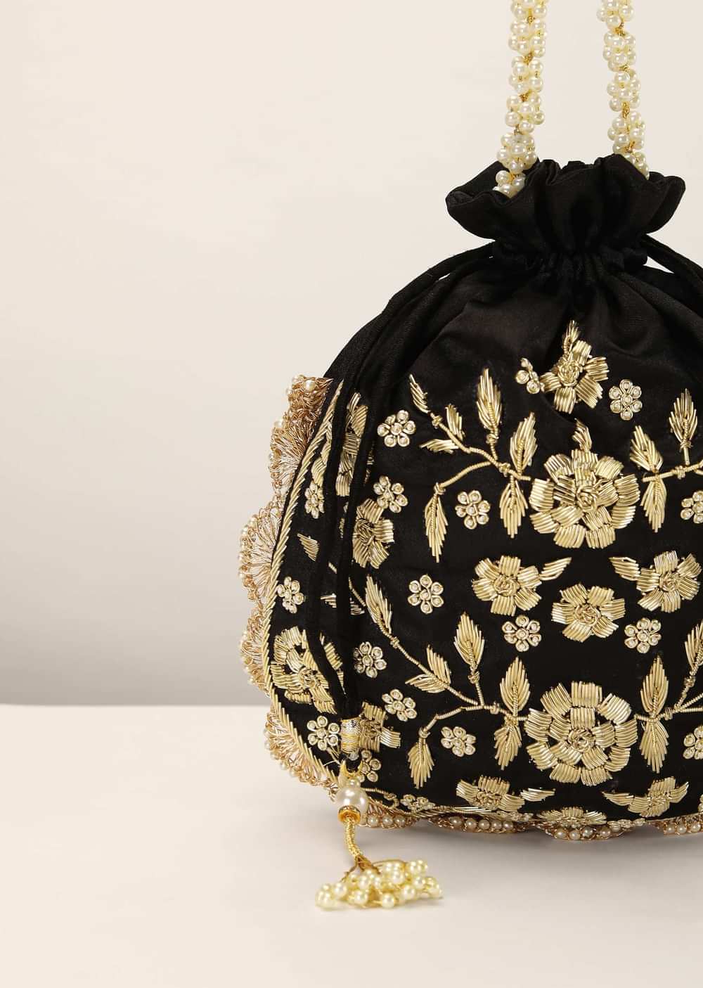 Black Potli In Satin With Hand Embroidery Detailing Using Zardosi And Moti Embroidered Floral Design