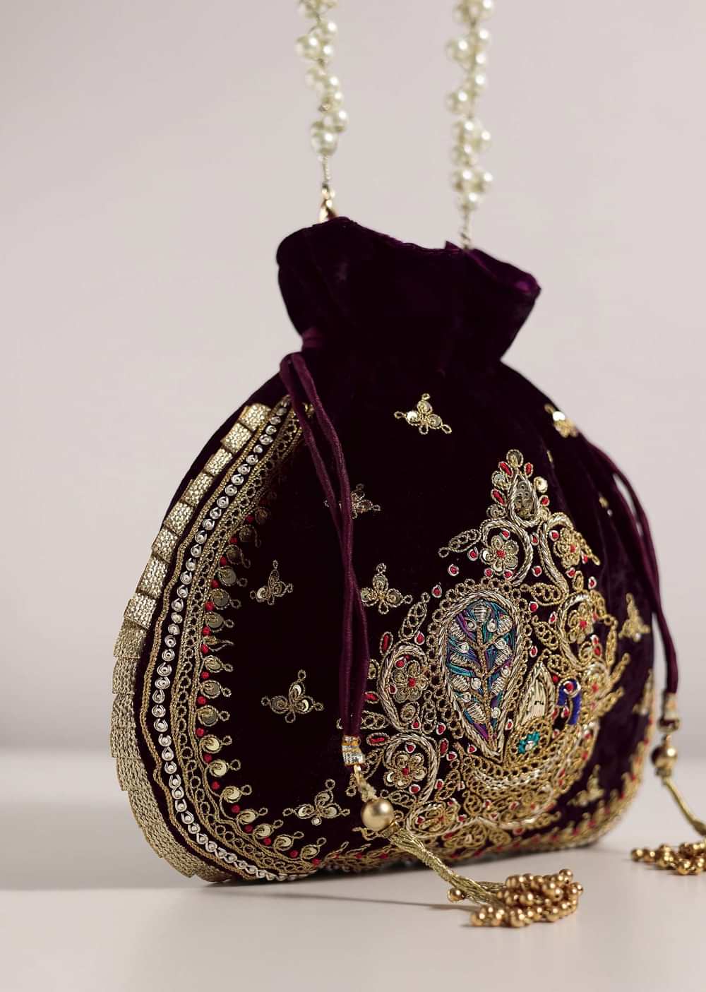 Black Raw Silk Festive Potli Bag With Heavy Motif Detailing
