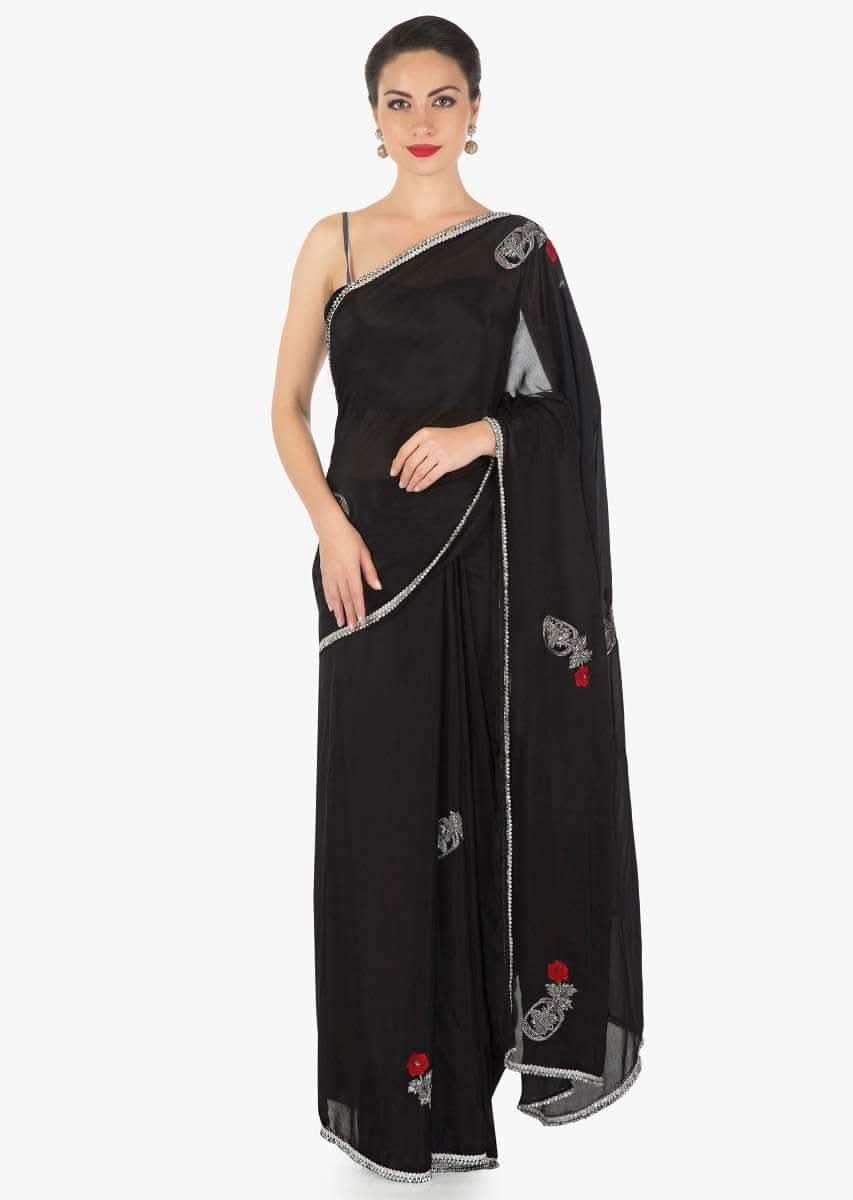 Black saree in chiffon satin with resham and cut dana embroidered butti in rose motif only on Kalki