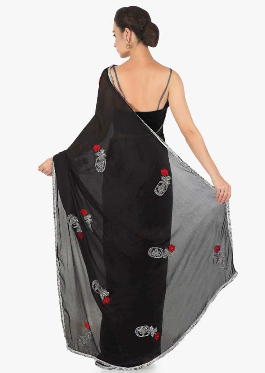 Black saree in chiffon satin with resham and cut dana embroidered butti in rose motif