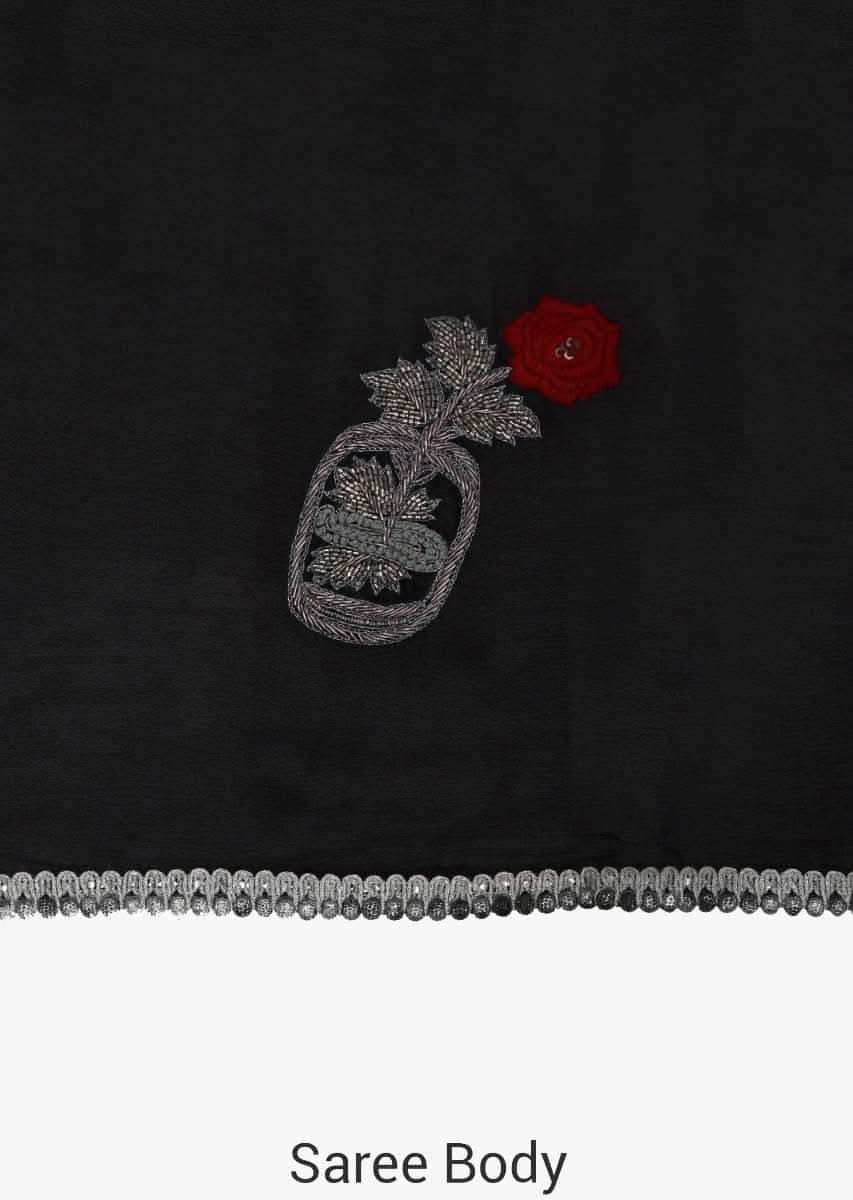 Black saree in chiffon satin with resham and cut dana embroidered butti in rose motif