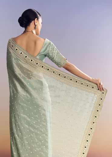 Blue Tissue Saree With Embroidered Border And Emerald Stone