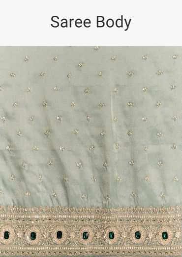 Blue Tissue Saree With Embroidered Border And Emerald Stone