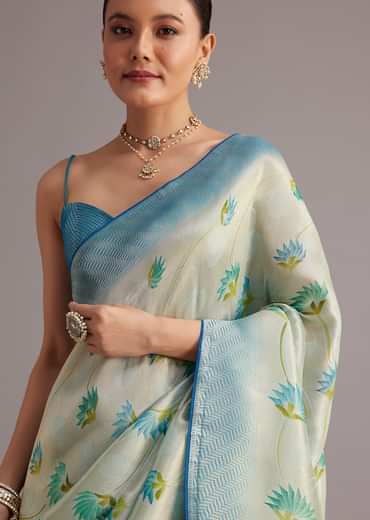 Blue Tissue Silk Saree With Floral Motifs And Contrast Pallu And Border