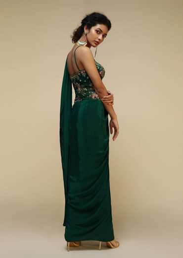 Bottle Green Saree Gown With A Crepe Cowl Drape And Sheer Embroidered Net Bodice With Colorful Resham Flowers