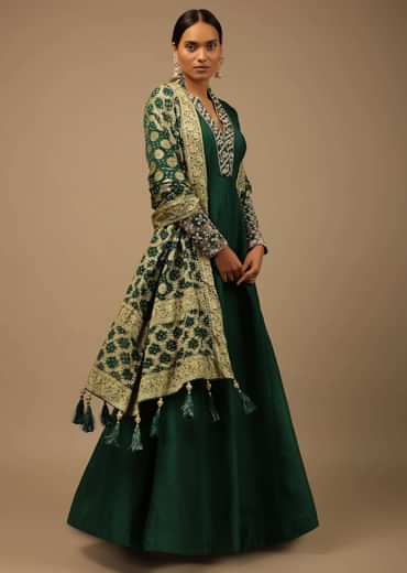 Bottle Green Anarkali Suit In Raw Silk With Hand Embroidery And A Brocade Dupatta Enhanced With Bandhani