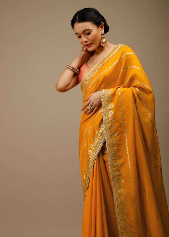 Cadmium Yellow Saree In Dola Silk With Lurex Woven Stripes On The Pallu And Geometric Floral Motifs On The Pleats