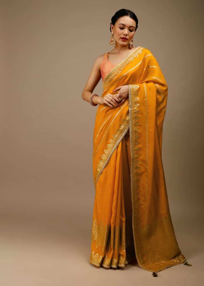 Cadmium Yellow Saree In Dola Silk With Lurex Woven Stripes On The Pallu And Geometric Floral Motifs On The Pleats