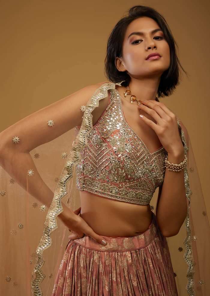 Rust Orange Lehenga Choli With Brocade Weave And Mirror Embroidery