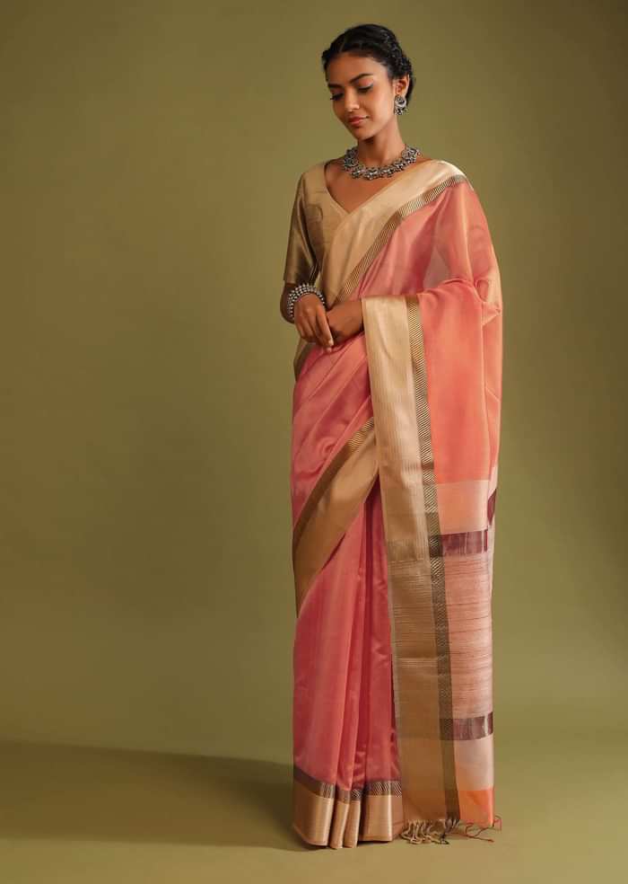 Carrot Coral Saree In Tussar Silk With A Contrasting Woven Golden Border And Textured Tussar Detailing On The Pallu