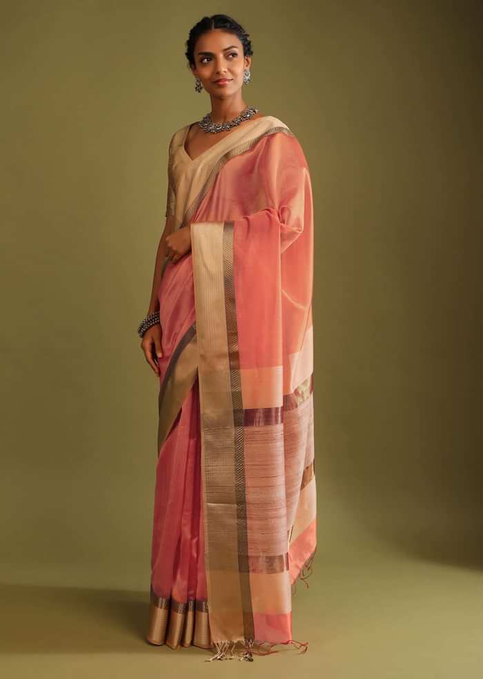 Carrot Coral Saree In Tussar Silk With A Contrasting Woven Golden Border And Textured Tussar Detailing On The Pallu