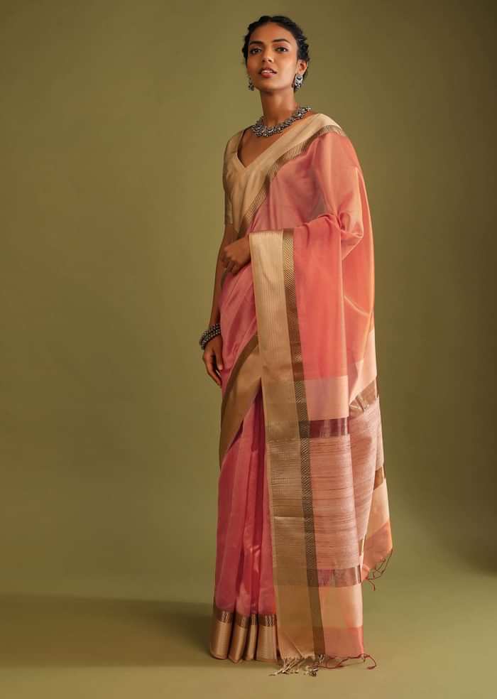 Carrot Coral Saree In Tussar Silk With A Contrasting Woven Golden Border And Textured Tussar Detailing On The Pallu