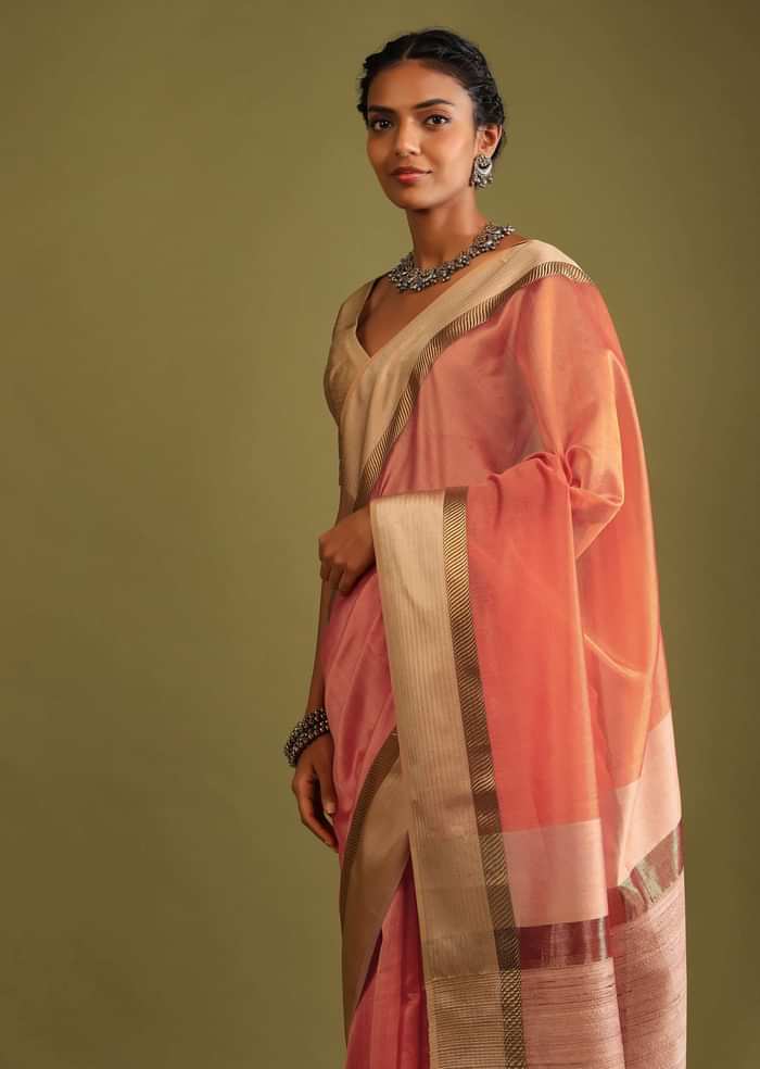 Carrot Coral Saree In Tussar Silk With A Contrasting Woven Golden Border And Textured Tussar Detailing On The Pallu