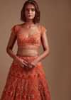 Coral Orange Lehenga Choli In Net With Mirror And Sequins Embroidered Floral And Mughal Embroidery Along With Belt Detailing