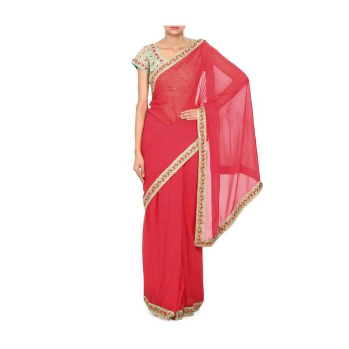 Coral pink saree matched with embroidered blouse only on Kalki