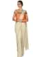 Cream foil saree gown with orange brocade bodice only on Kalki