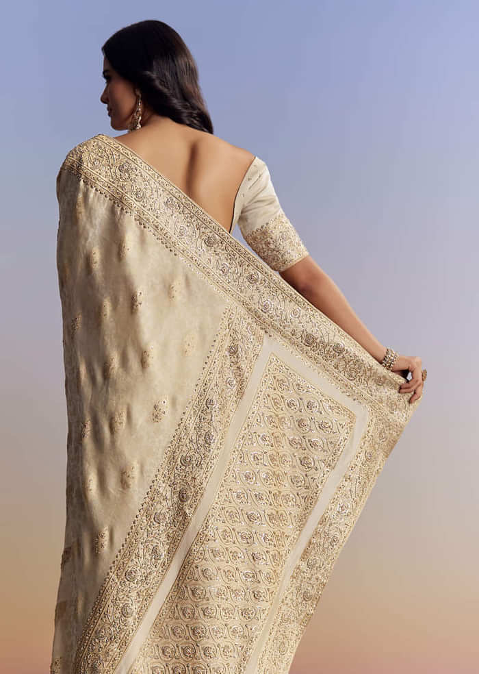 Cream Jacquard Silk Saree With Zari Brocade And Zardosi Embellished Pallu