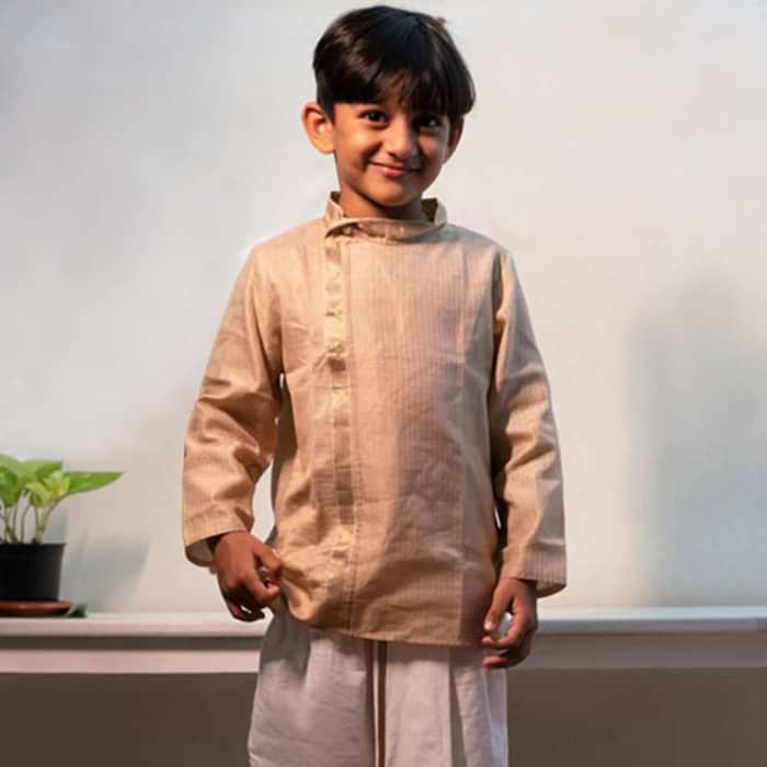 Kalki Boys Cream Kurta In Hand-woven Cotton Silk With Zari Enhanced Placket And Twisted Design At The Neck Love The World Today
