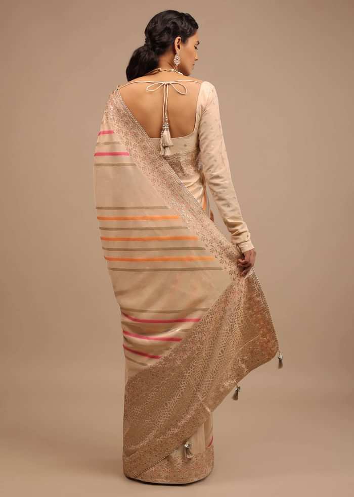 Cream Saree In Dola Silk With Multi Colored Woven Diagonal Stripes And Floral Border