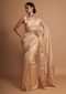 Dark cream organza saree with hand embroidered floral buttis Online - Kalki Fashion