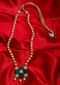 Dark cream pearl necklace with geometric shaped pendant with emerald green bead and kundan stone only on Kalki