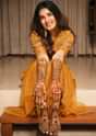 Dark Amber Yellow Palazzo Suit In Organza With Matching Peplum Top Adorned In Zari And Thread Work
