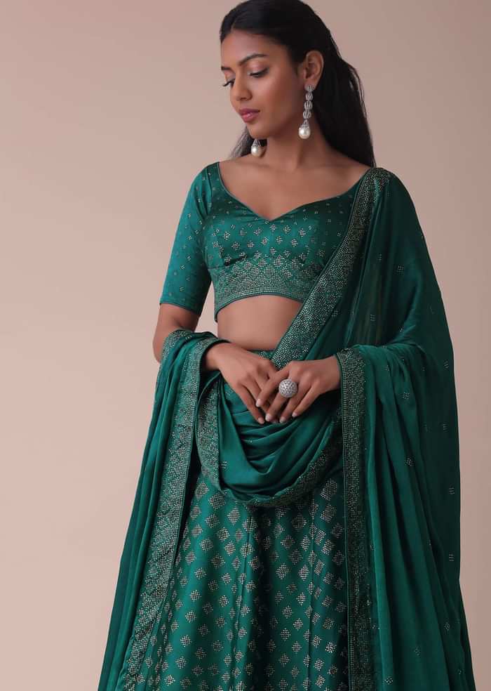 Deep Green Wrinkle Satin Lehenga Embellished In Swarovski