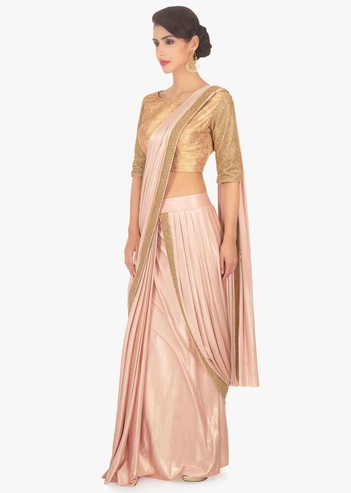 Fancy fabric peach blouse with lycra saree skirt in ready plated pre stitched pallo only on Kalki