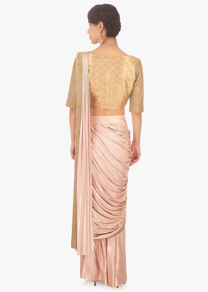 Fancy fabric peach blouse with lycra saree skirt in ready plated pre stitched pallo only on Kalki