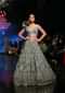 Fern Green Lehenga Choli In Net With Stone Hand Embroidered Floral Motifs And Fancy Origami Cones On The Shoulder