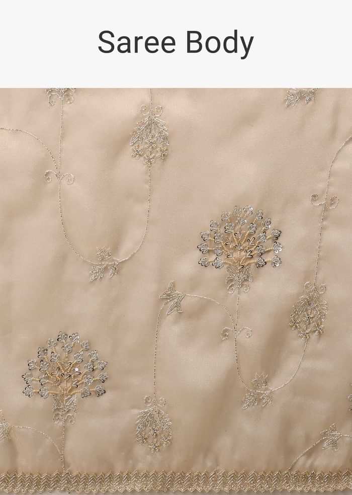 Frosted Almond Tissue Saree In Zardozi Embroidery Buttis, Leafy Motifs Embroidery Detailing On Border