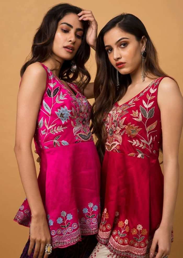 Fuchsia Pink Peplum Top With Aari Work Paired With Navy Blue Bandhani Printed Cowl Pants
