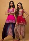 Fuchsia Pink Peplum Top With Aari Work Paired With Navy Blue Bandhani Printed Cowl Pants
