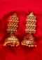 Gold cut out earring with blood red meenakari jhumkas