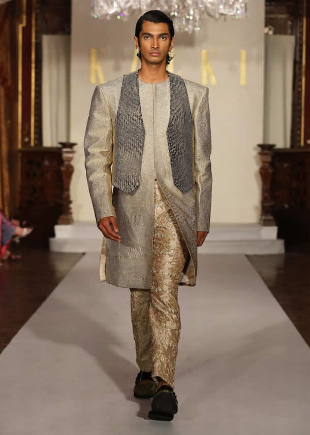 Gold Metallic Hand Embroidered Bridal Gown With Asymmetric Fall