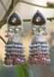 Gold Plated Jhumkas With Carved Stone And Studded With Kundan And Pearls Along With Bead Fringes