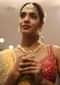 Gold Plated Necklace Studded With Kundan And Pearls Along With Round Pendant And Dangling Tassel Online - Kalki Fashion