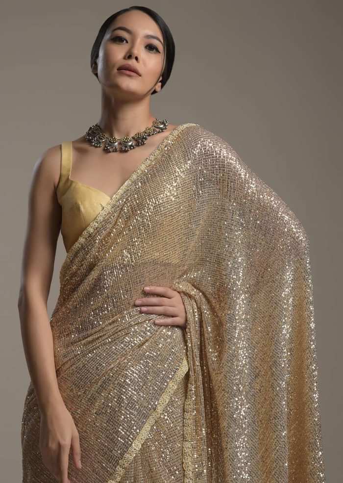 Gold Saree Embellished In Sequins With Moti Embroidered Border And Unstitched Blouse Online - Kalki Fashion