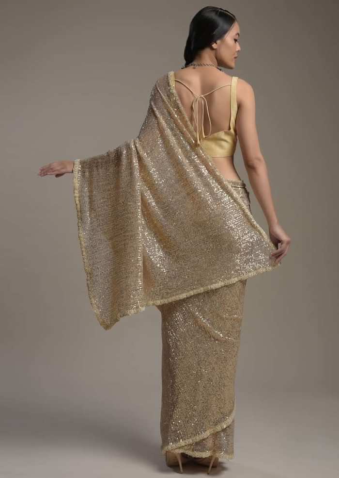 Gold Saree Embellished In Sequins With Moti Embroidered Border And Unstitched Blouse Online - Kalki Fashion